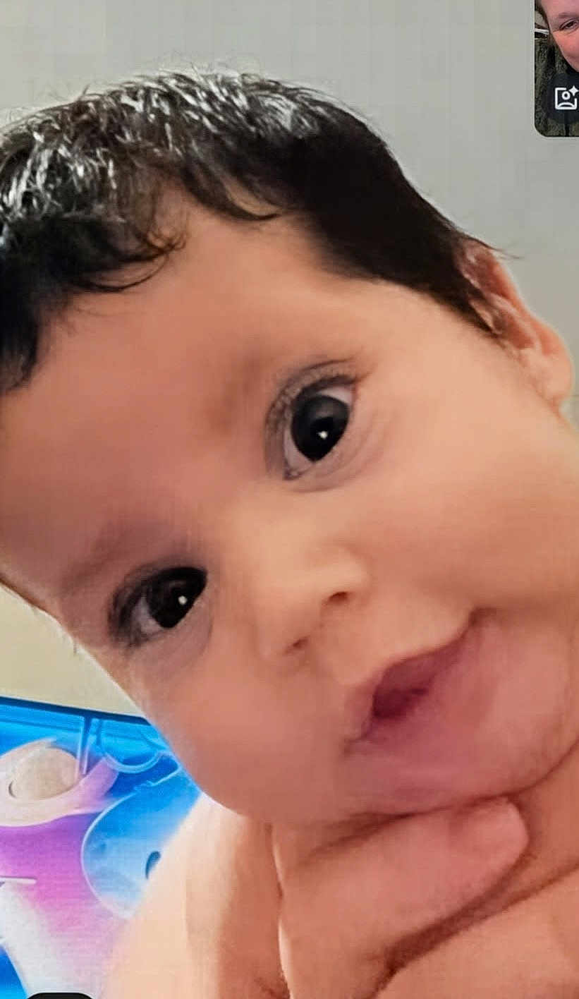 Jakobe joined the competition — help win amazing prizes! baby, background, child, close_up, curious, cute, expression, eyes, face, hand, head, human, indoors, infant, looking, person, portrait, skin, soft_light, young