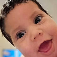 Jakobe is registered to the contest to win money with this photo: baby, close_up, face, smile, happy, child, cute, expression, eyes, skin, hair, mouth, portrait, infant, cheerful, young, person, indoor, joy, head