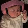 Lyra joined the competition — help win amazing prizes! baby, headphones, pink, sleeping, white_bib, white_clothing, infant, child, peaceful, hand, plush_toy, dark_background, soft_lighting, cute, portrait, indoors, baby_girl, cozy, sleep, childhood