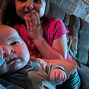 Kaydence joined the competition — help win amazing prizes! baby, child, couch, wooden_wall, indoor, smiling, person, clothing, hand, face, portrait, sitting, cute, happy, young_child, home, family, casual, toddler, cozy