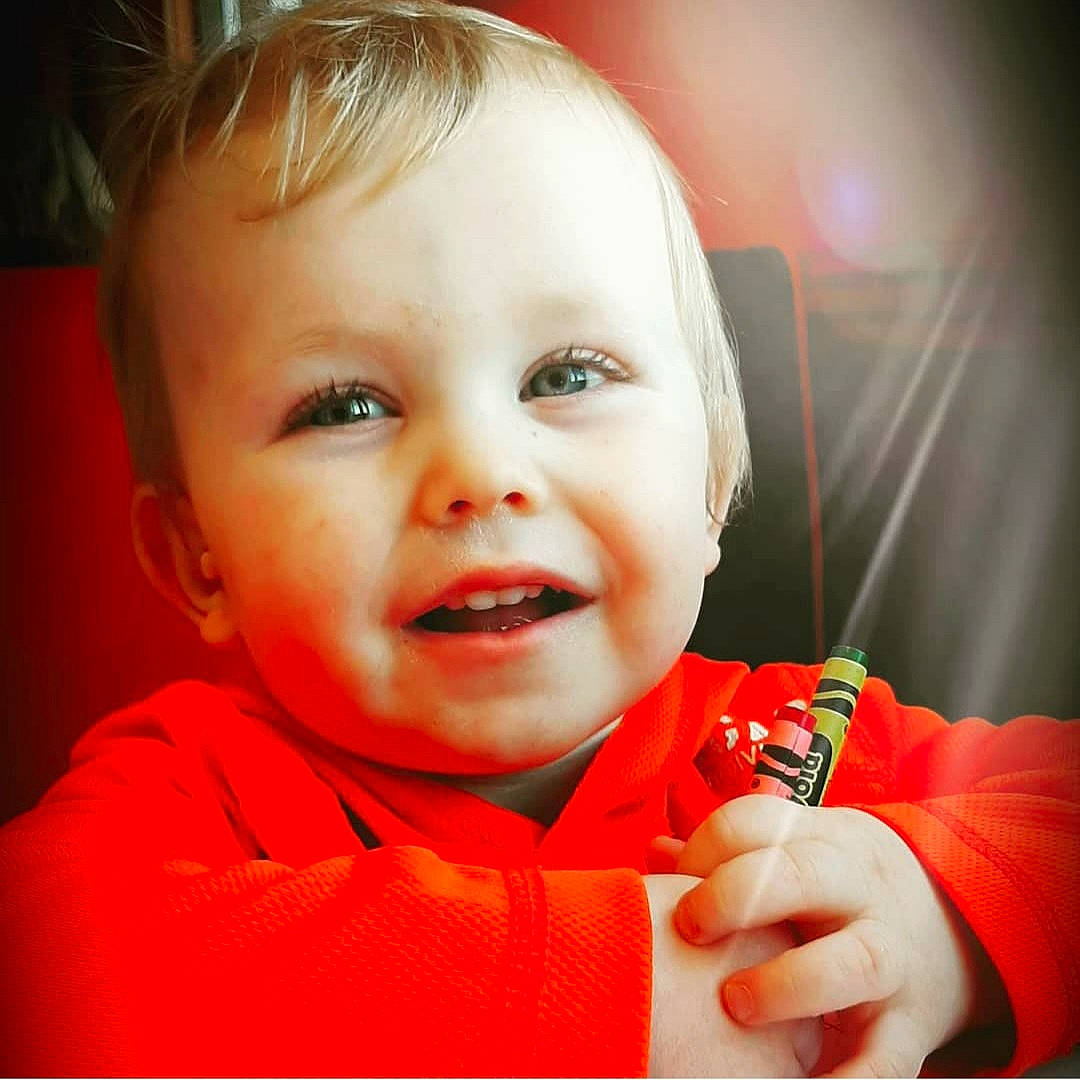 Jaron joined the competition — help win amazing prizes! baby, baby_toddler_clothing, beauty, cheek, child, close_up, ear, eyelash, face, finger, flash_photography, gesture, happy, lip, nose, orange, person, sleeve, smile, thumb