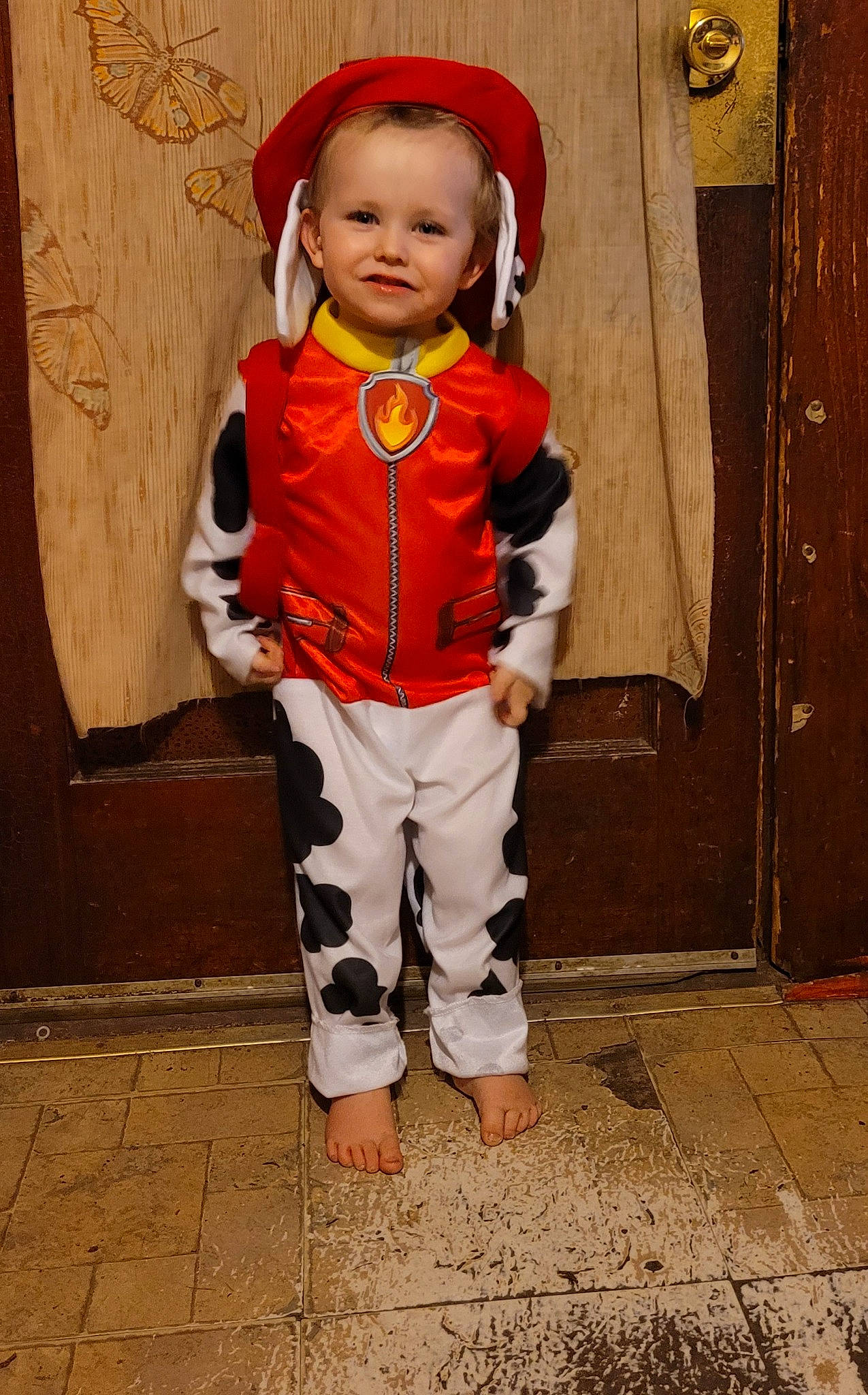 Jaron is registered to the contest to win money with this photo: arm, baby, baby_toddler_clothing, child, costume_hat, door, face, fashion, fashion_design, formal_wear, fun, happy, joy, orange, outerwear, person, personal_protective_equipment, sleeve, standing, street_fashion