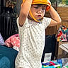 Cataleya Nykishia joined the competition — help win amazing prizes! toddler, child, bucket, indoor, toy, playful, onesie, expression, face, standing, funny, home, clothing, furniture, colorful, background, person, cute, puffed_cheeks, casual