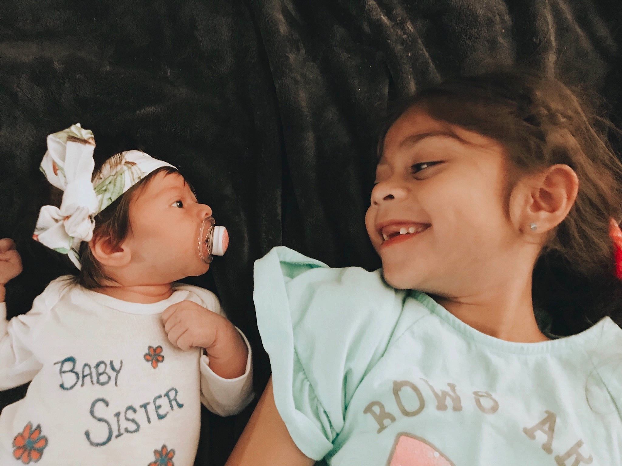 Ava joined the competition — help win amazing prizes! baby, cheek, child, daughter, fun, gesture, happy, headwear, mother, nose, person, sibling, skin, smile, toddler