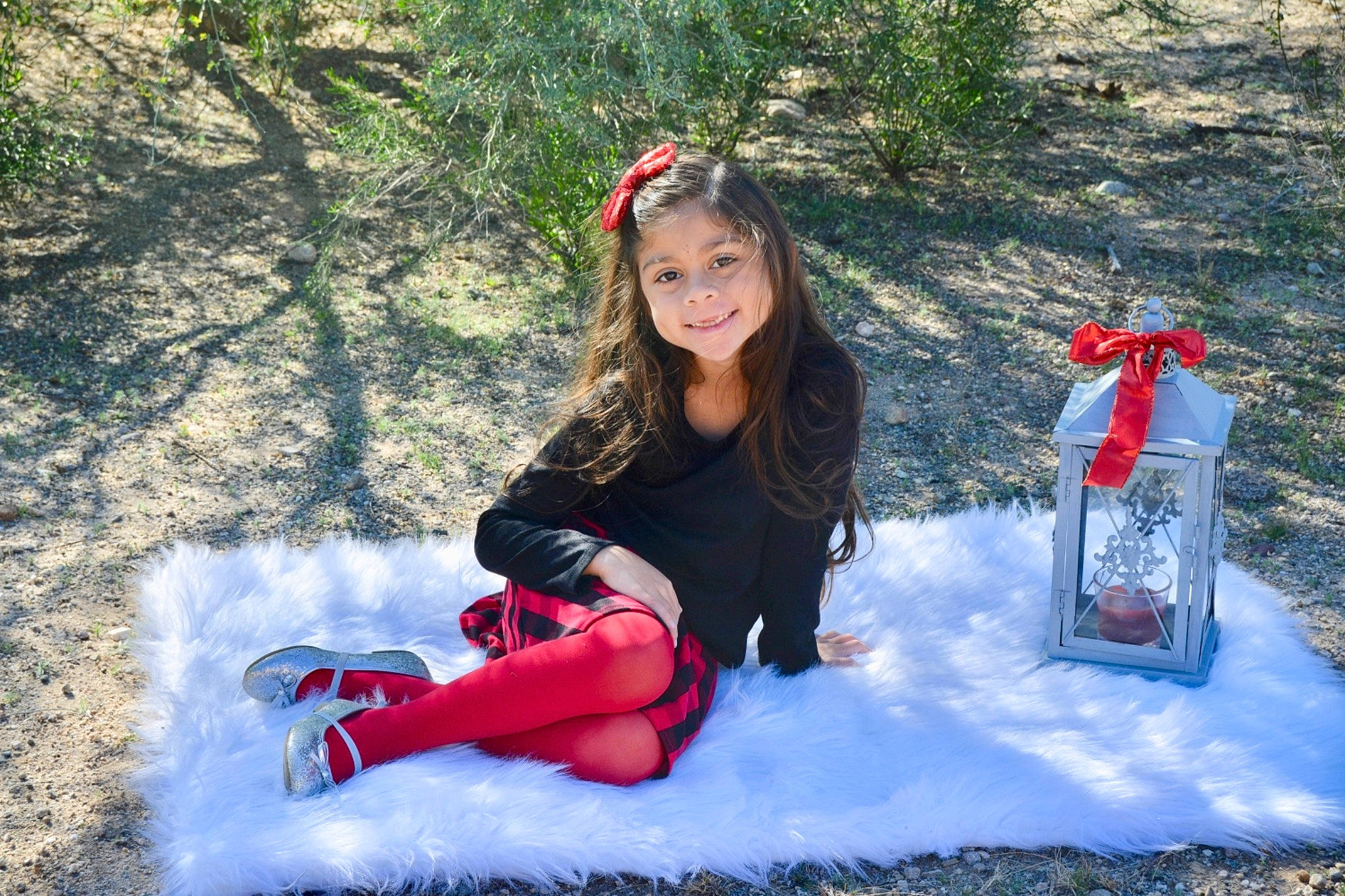 Ava is registered to the contest to win money with this photo: footwear, freezing, fun, joy, person, play, recreation, red, sitting, smile, snow, style, tree, vacation, water, winter