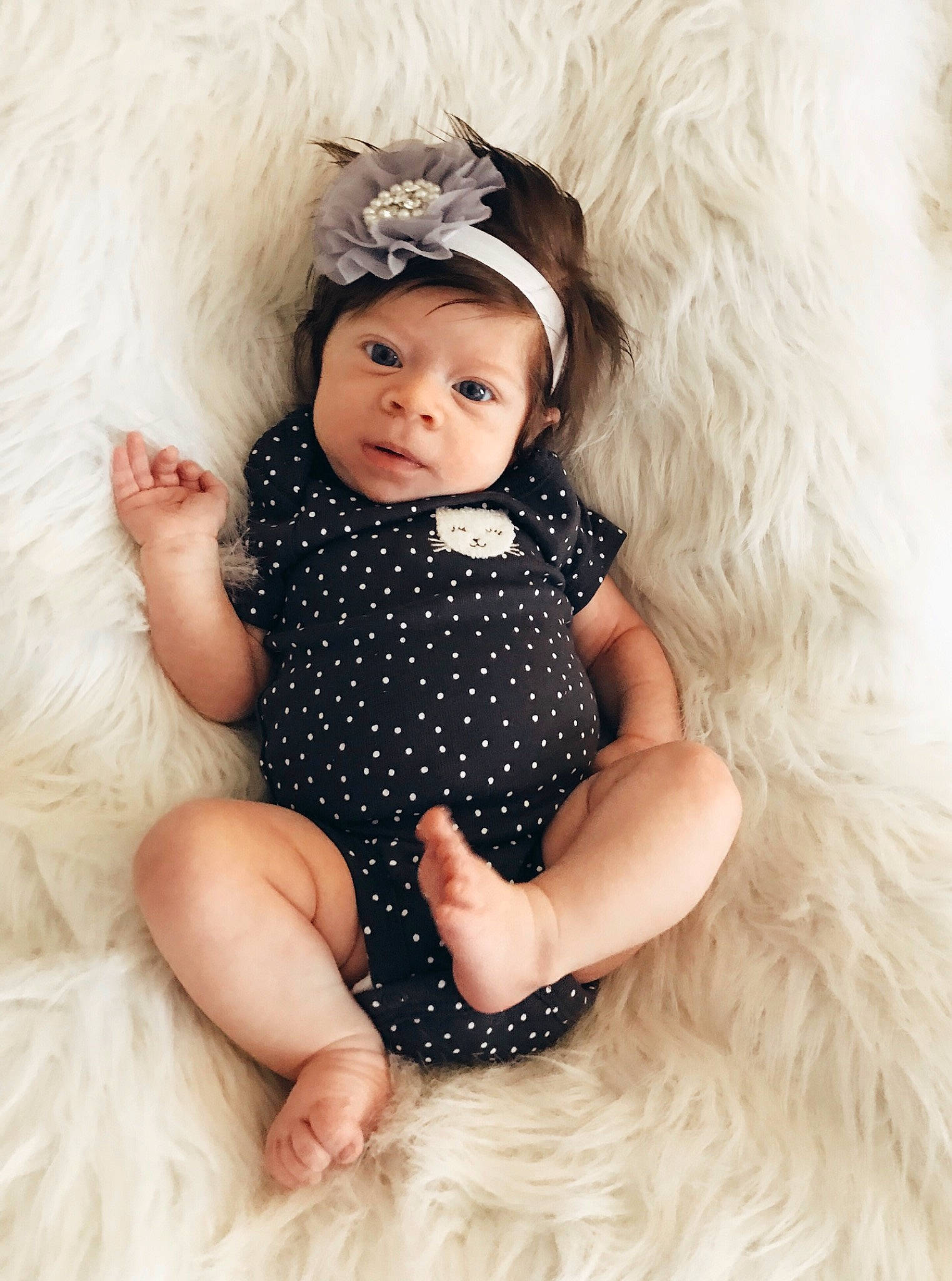 Delaney  is registered to the contest to win money with this photo: baby, baby_bloomers, baby_products, baby_toddler_clothing, child, child_model, costume_accessory, dress, fashion_accessory, fur, hair_accessory, headgear, headpiece, outerwear, person, photo_shoot, photography, skin, smile, toddler