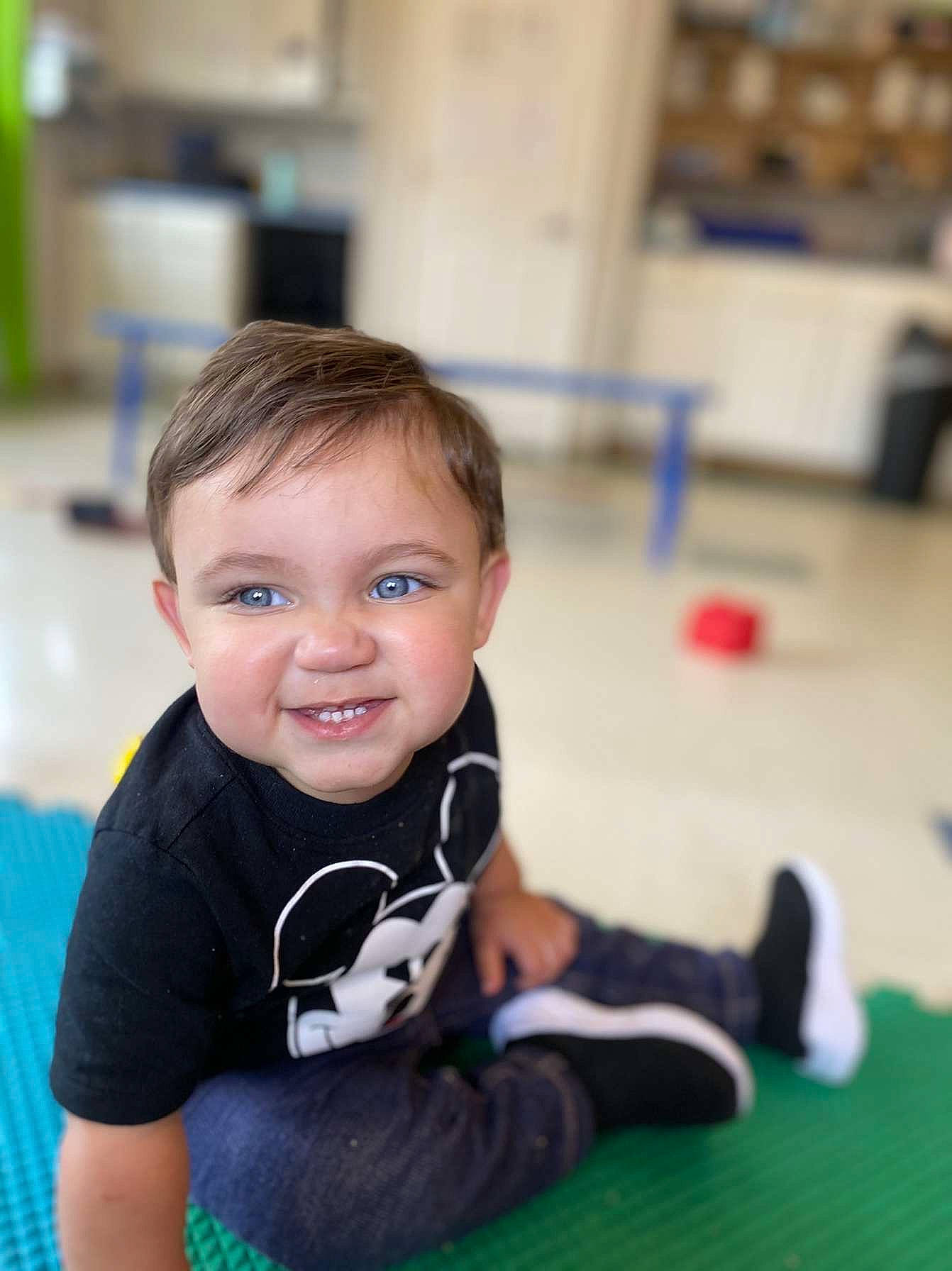 Kye joined the competition — help win amazing prizes! baby, child, flooring, fun, happy, hardwood, human_leg, indoor_games_and_sports, joint, joy, knee, leisure, person, recreation, sitting, skin, smile, sportswear, t_shirt, toddler
