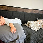 Tiffany joined the competition — help win amazing prizes! baby, sleeping, pillow, bed, blanket, plush_toy, onesie, infant, resting, indoor, cozy, young_child, head, hand, soft_fabric, peaceful, child, toddler, cute, home