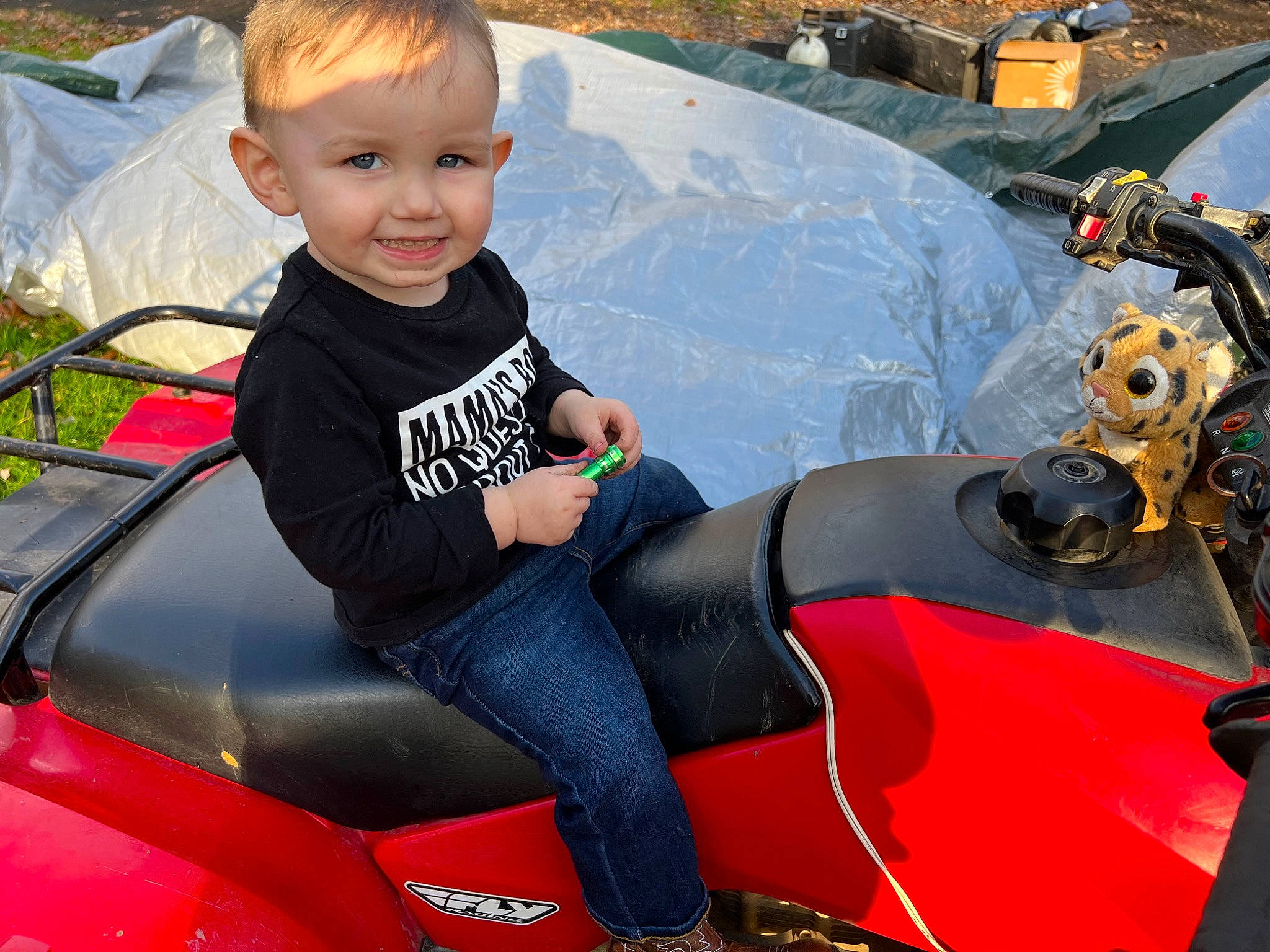 Jonathan is registered to the contest to win money with this photo: auto_part, automotive_design, automotive_exterior, automotive_lighting, automotive_tire, automotive_wheel_system, automotive_window_part, bumper, fender, fun, hood, leisure, motor_vehicle, person, recreation, smile, steering_wheel, toddler, vehicle, vehicle_door