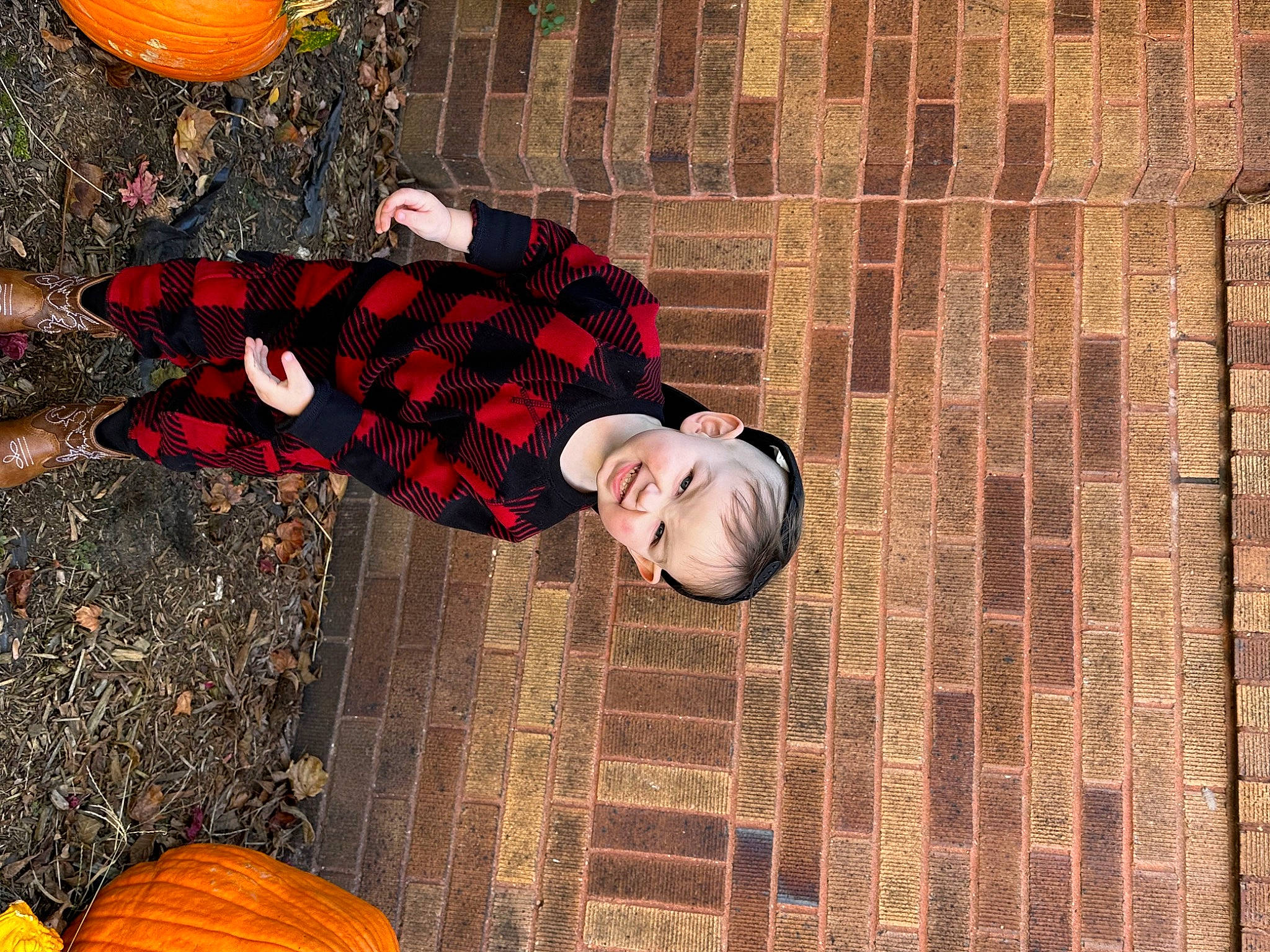 Jonathan is registered to the contest to win money with this photo: ball, brick, brickwork, calabaza, cucurbita, flooring, fun, gourd, grass, hat, human_leg, leisure, orange, pattern, person, plaid, pumpkin, tartan, tree, winter_squash