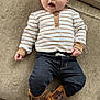 Bennett joined the competition — help win amazing prizes! baby, infant, child, couch, striped_shirt, dark_pants, cowboy_boots, footwear, clothing, face, wide_eyes, open_mouth, indoors, carpet, person, cute, expression, sitting, human, furniture