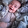 Bennett joined the competition — help win amazing prizes! baby, smiling, blanket, cozy, soft_texture, infant, face, happy, child, cute, warm, comfort, indoors, wrapped, portrait, closeup, sleepwear, plush, rest, relaxation