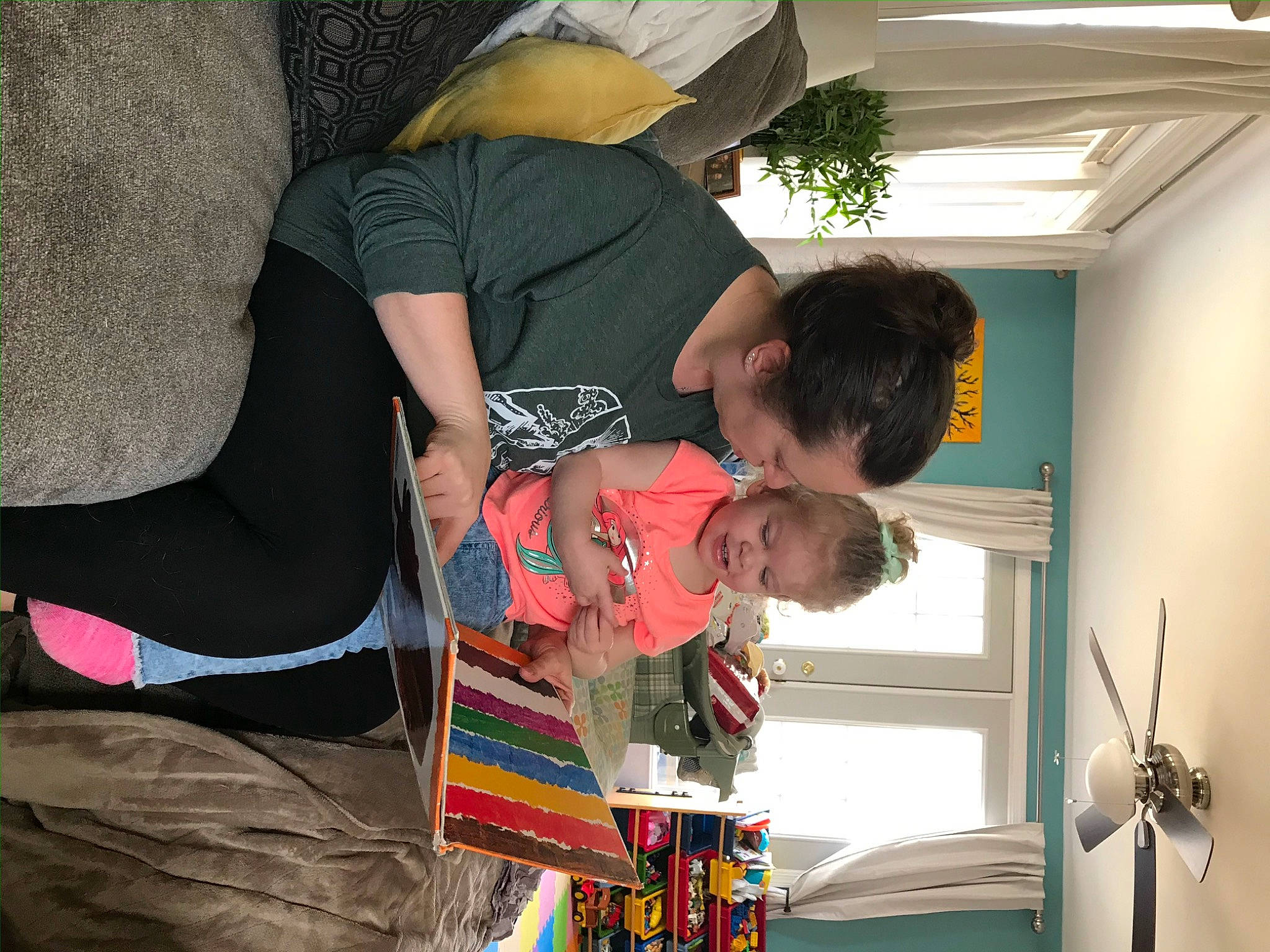 Lyla is registered to the contest to win money with this photo: cap, comfort, event, eyewear, fun, happy, hat, leisure, pattern, person, picture_frame, room, smile, sun_hat, t_shirt, toddler, visual_arts, window