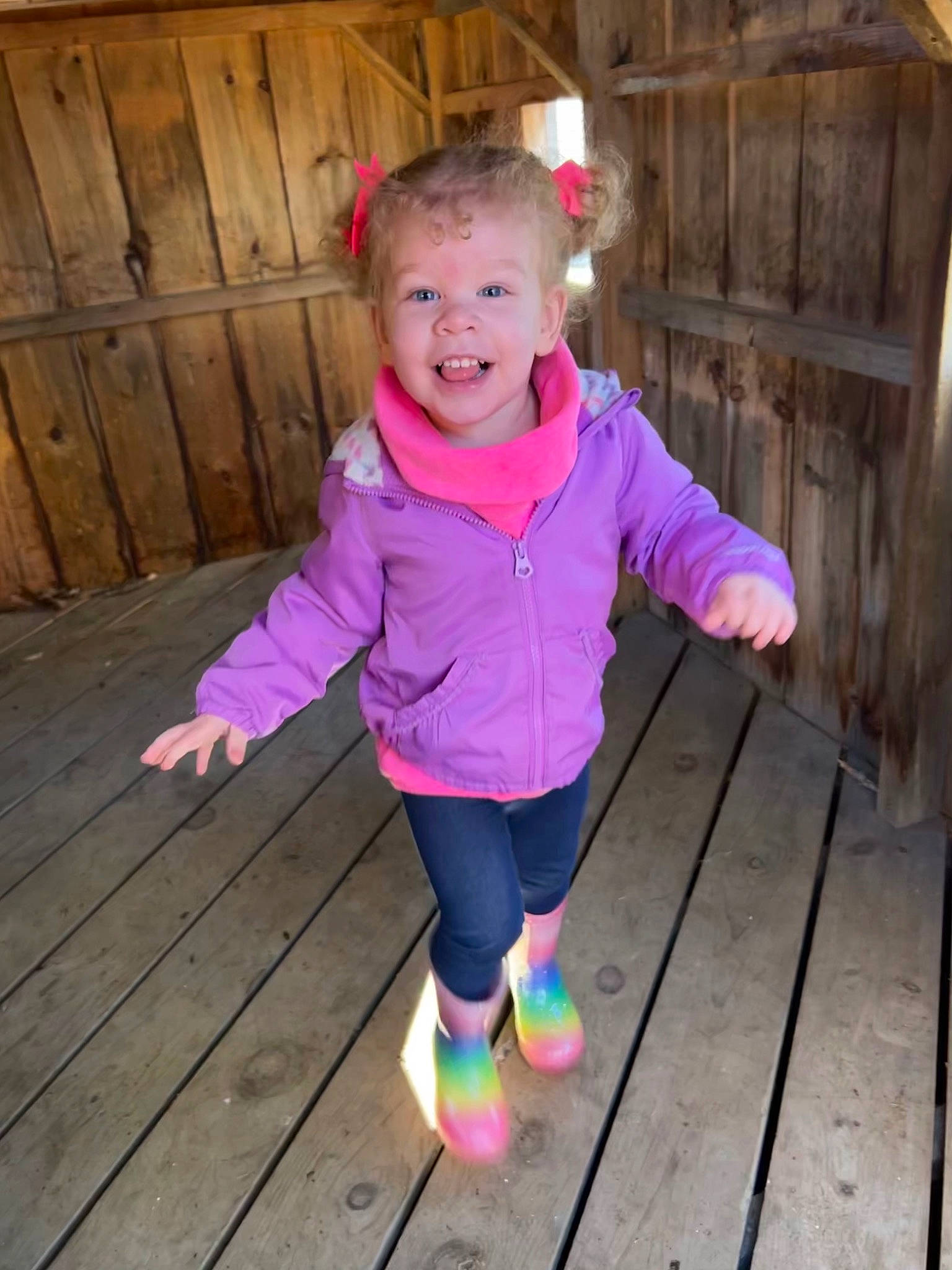 Lyla joined the competition — help win amazing prizes! baby_toddler_clothing, child, door, fun, grass, happy, hardwood, leisure, magenta, outerwear, pattern, person, pink, plank, purple, sleeve, smile, t_shirt, toddler, wood