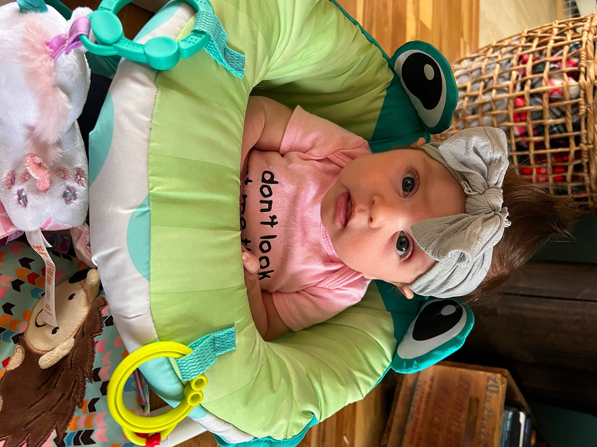 Aleena joined the competition — help win amazing prizes! baby, baby_products, baby_toddler_clothing, baby_toys, cheek, child, costume, event, facial_expression, fun, green, happy, headwear, person, plastic, play, product, room, snapshot, toddler