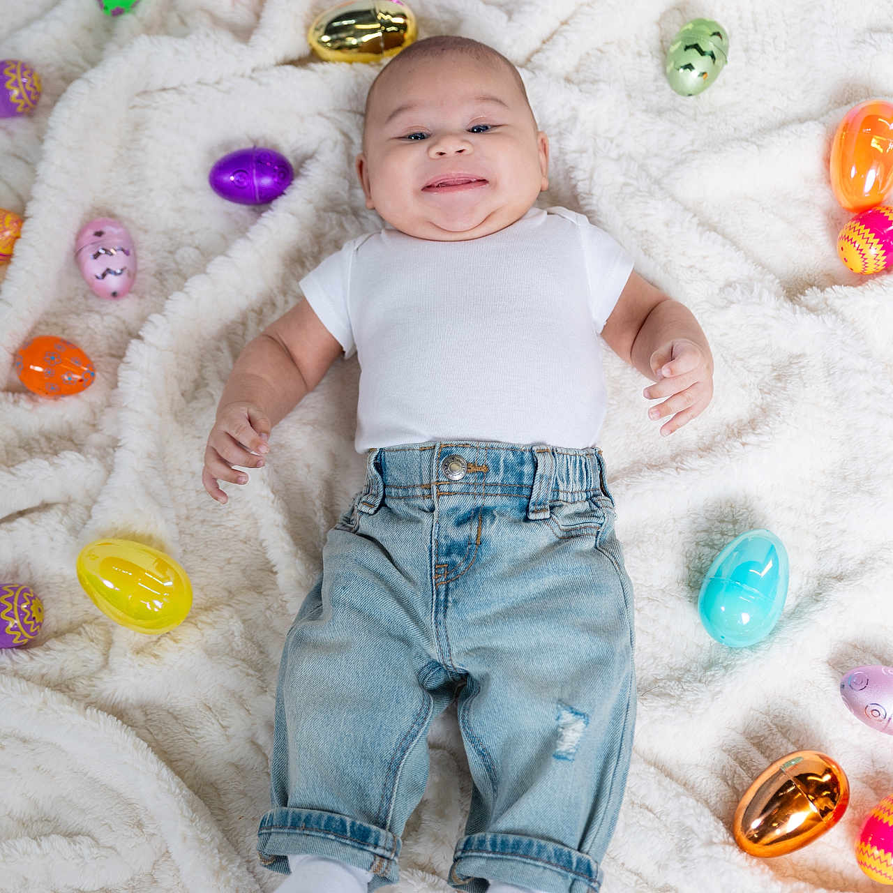 Kyaire is registered to the contest to win money with this photo: baby, blanket, bodypart, clothing, egg, face, finger, food, hand, happy, head, hosiery, jeans, pants, person, photography, portrait, smile, sock, sweets
