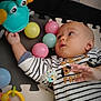 Noa participe au concours pour gagner de l'argent avec cette photo : baby, infant, toy, play_mat, colorful_balls, striped_sweater, hand, face, pacifier, plastic_toy, child, indoor, cute, exploration, lying_down, playtime, striped_clothing, bright_colors, curious, baby_toys