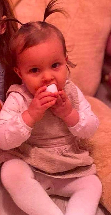 Camilya participe au concours pour gagner de l'argent avec cette photo : baby_toddler_clothing, cheek, chin, dress, ear, eye, face, gesture, hair, hairstyle, hand, happy, head, human_body, lip, mouth, neck, nose, person, skin