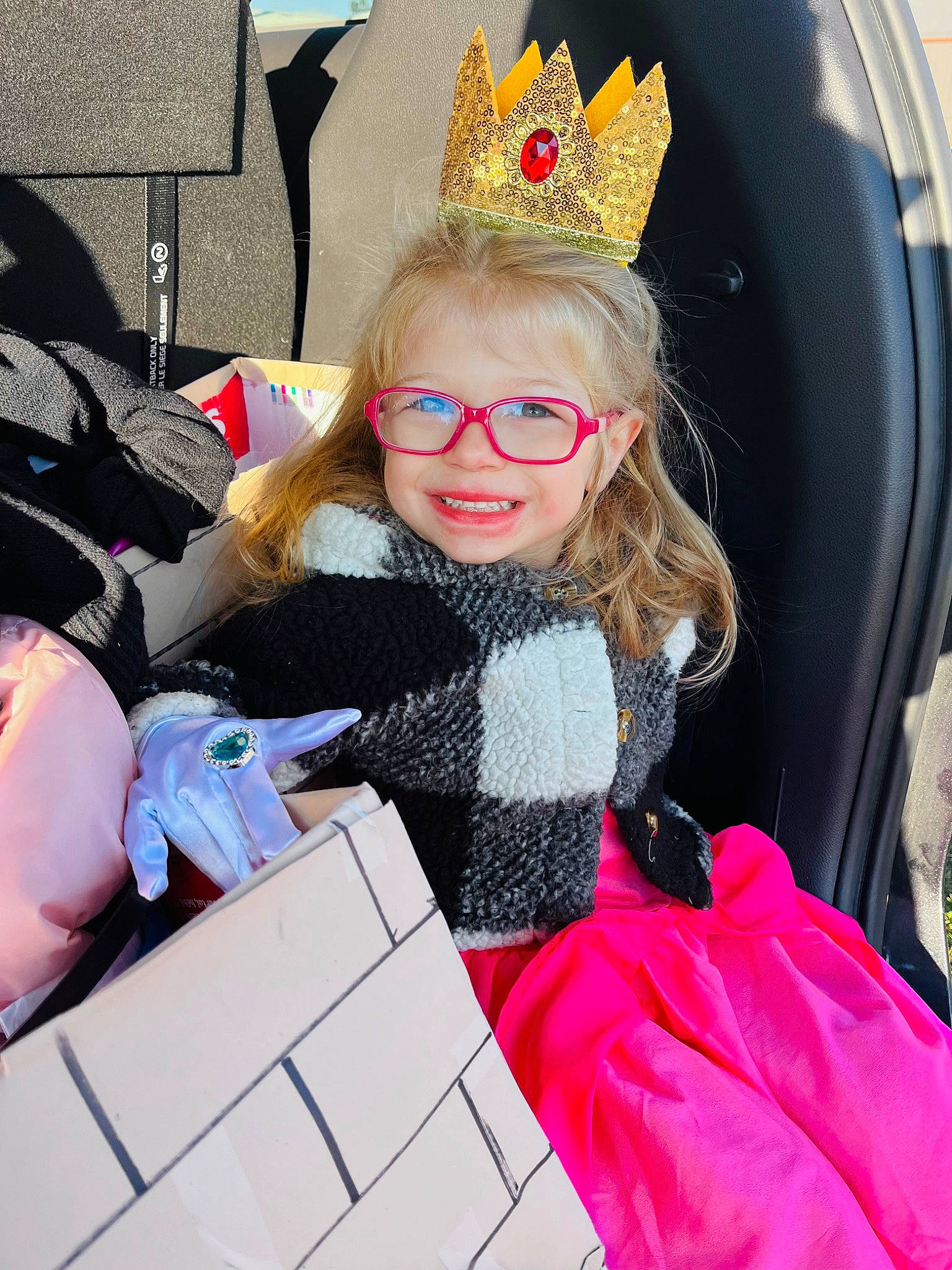 Austyn is registered to the contest to win money with this photo: bag, child, costume, costume_hat, event, eyewear, fashion_accessory, fashion_design, fun, happy, joy, leisure, luggage_and_bags, magenta, person, personal_protective_equipment, pink, recreation, red, smile