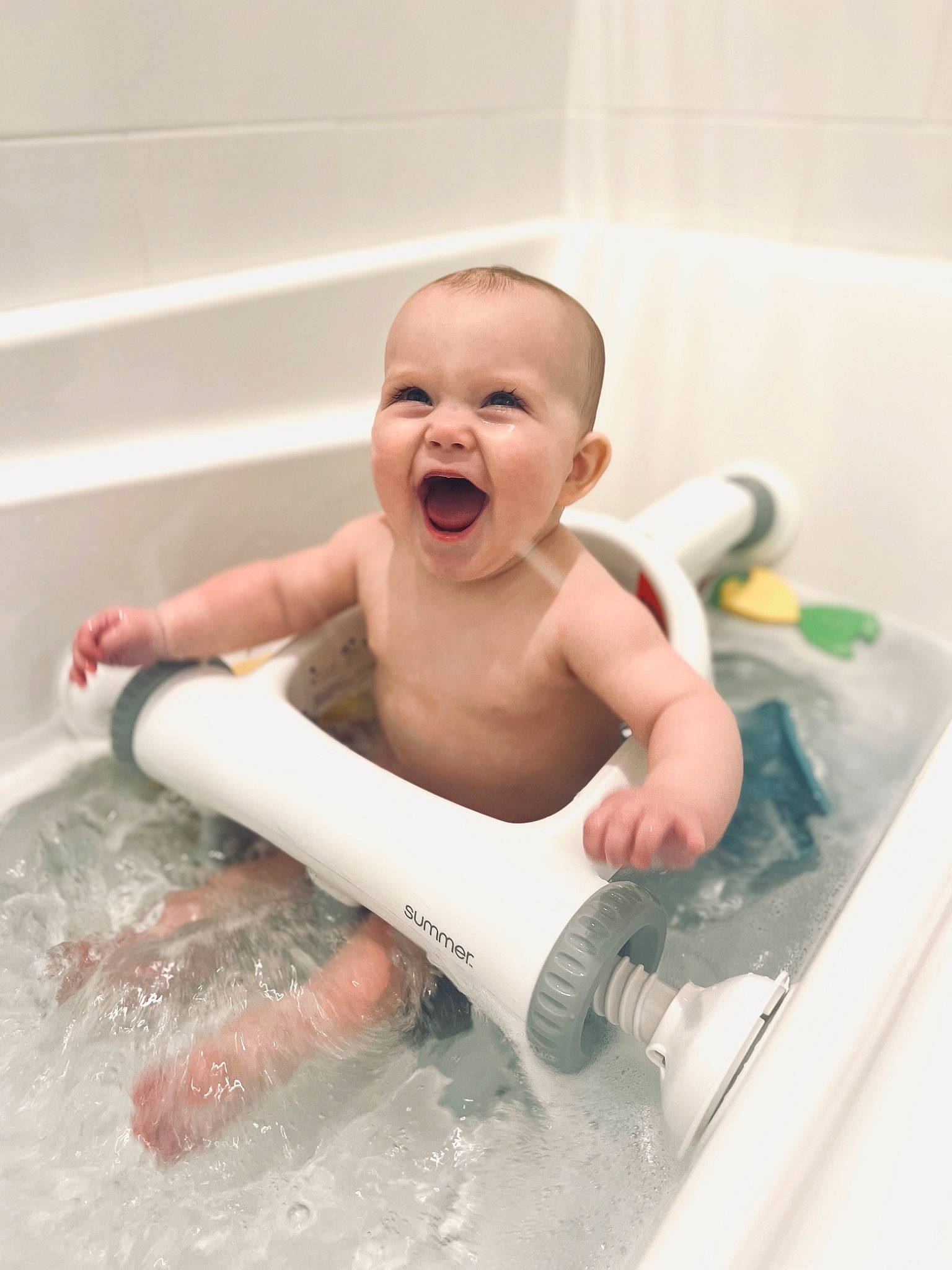 Hadley is registered to the contest to win money with this photo: baby, baby_bathing, baby_products, bathing, bathroom, bathtub, child, fluid, fun, happy, leisure, liquid, person, personal_care, plumbing, plumbing_fixture, room, skin, smile, toddler