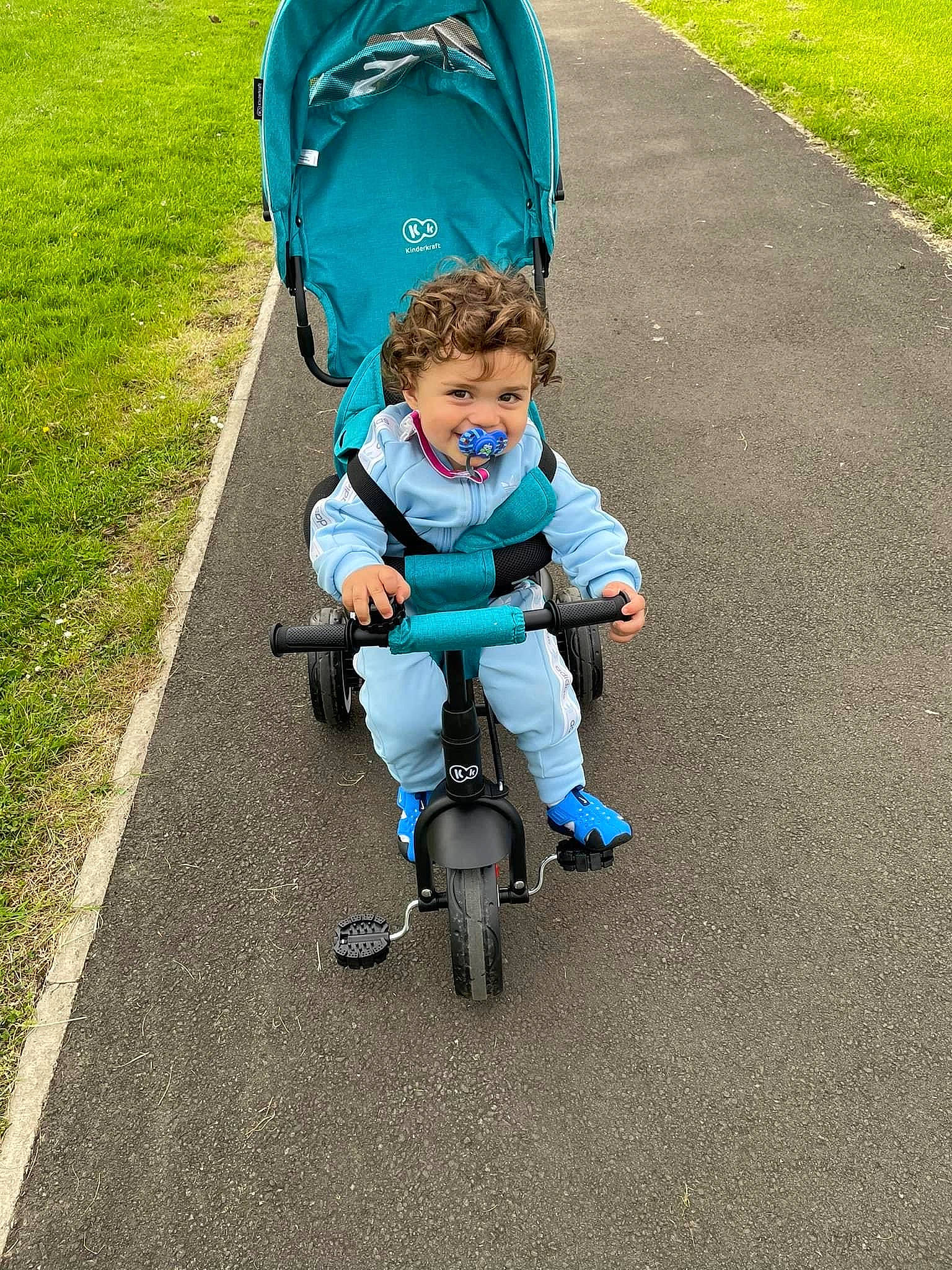 Dominic joined the competition — help win amazing prizes! asphalt, baby, baby_carriage, baby_products, baby_toddler_clothing, bicycle, bicycle_wheel, bicycles_equipment_and_supplies, electric_blue, fun, grass, leisure, people_in_nature, person, recreation, road, road_surface, rolling, tire, toddler