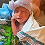 Summer joined the competition — help win amazing prizes! newborn, baby, infant, hat, striped_hat, blanket, hospital_blanket, smile, sleeping, wrapped, cute, person, hand, colorful_shirt, tattoo, indoor, closeup, portrait, peaceful, child