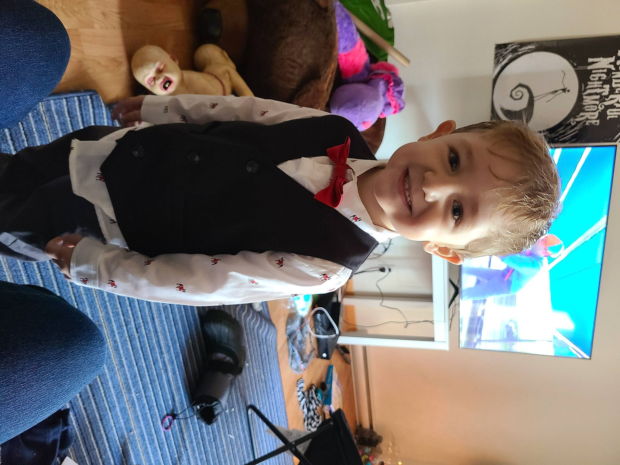 Jack is registered to the contest to win money with this photo: art, chair, child, comfort, eyewear, fun, happy, joy, person, room, smile, suit, toddler