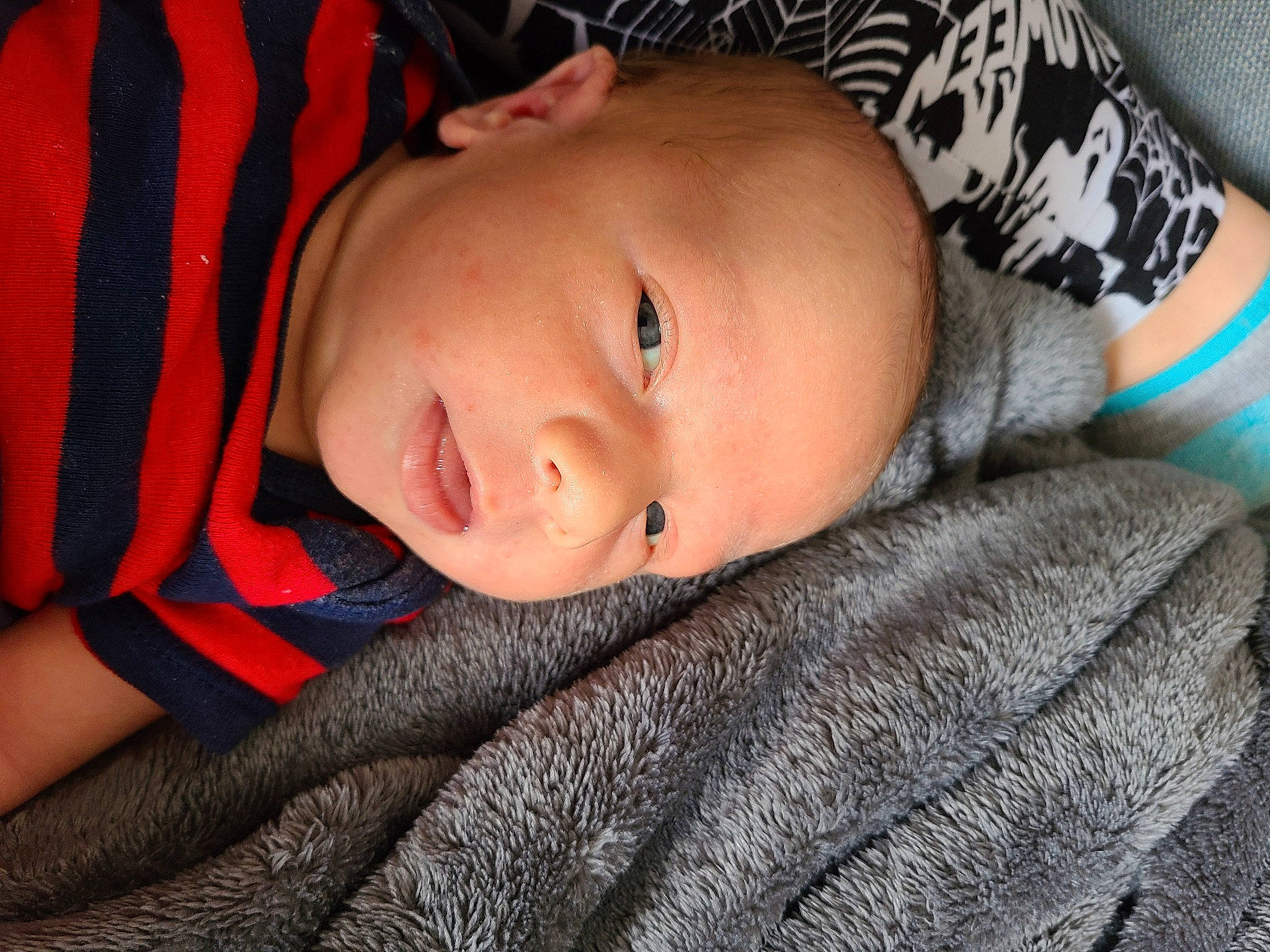 Nikolai is registered to the contest to win money with this photo: baby, baby_toddler_clothing, cheek, child, close_up, comfort, elbow, eye, eyelash, iris, linens, lip, mouth, neck, nose, pattern, person, skin, sleeve, toddler