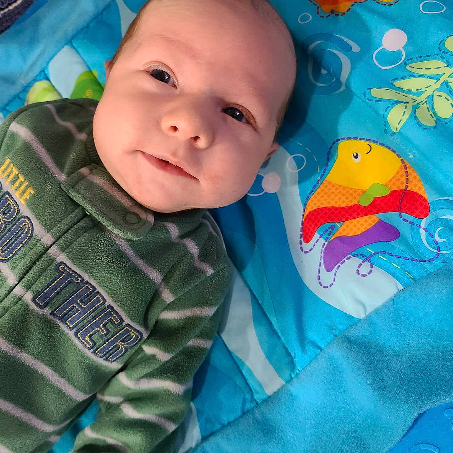 Nikolai joined the competition — help win amazing prizes! aqua, azure, baby, baby_products, baby_toddler_clothing, blue, cheek, child, comfort, electric_blue, fun, happy, linens, pattern, person, room, sleeve, smile, t_shirt, textile