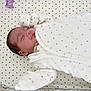 Melyssandre participe au concours pour gagner de l'argent avec cette photo : baby, newborn, sleeping, blanket, crib, bedding, stars, infant, cozy, white, pattern, soft_lighting, peaceful, child, cute, bed, resting, indoor, person, portrait