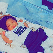 Mason is registered to the contest to win money with this photo: baby, bed, bedroom, blanket, clothing, cradle, crib, cushion, face, furniture, head, homedecor, indoors, infantbed, newborn, person, photography, portrait, room, sleeping