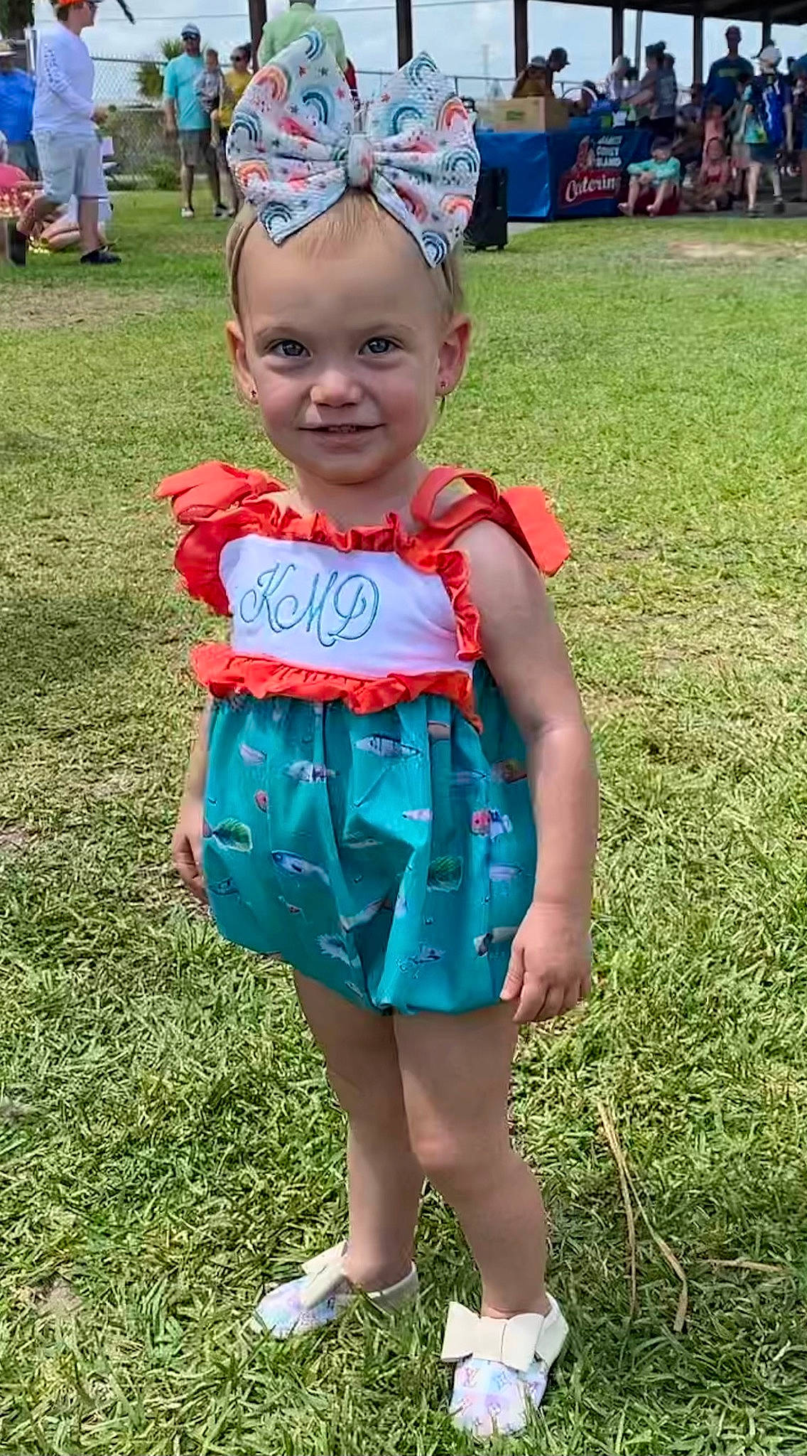 Kynslee is registered to the contest to win money with this photo: baby_toddler_clothing, baseball_cap, blue, cap, child, electric_blue, event, eye, fun, grass, green, happy, hat, headwear, joy, leisure, pattern, person, pink, skin