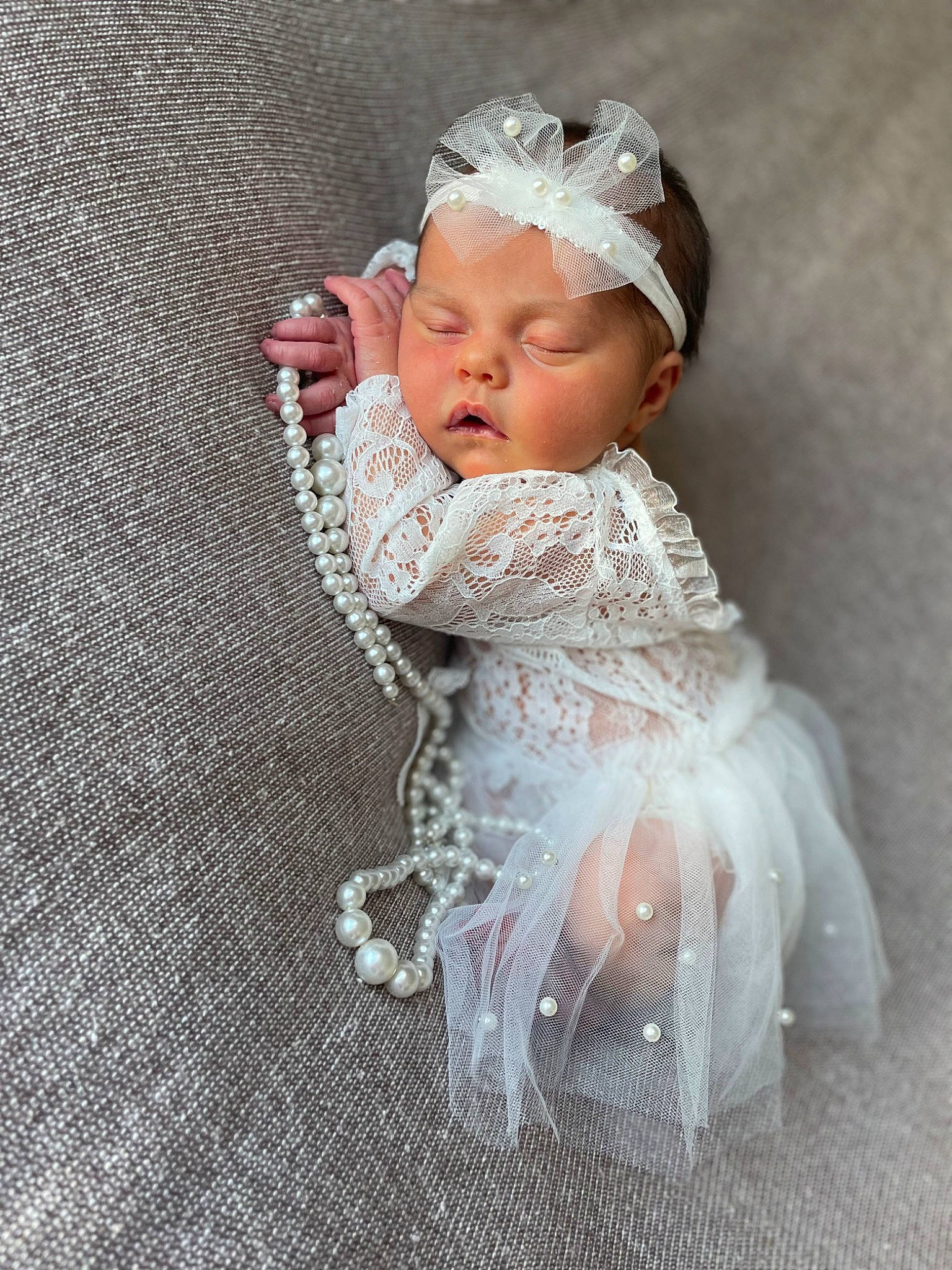 Kinleigh is registered to the contest to win money with this photo: baby, baby_toddler_clothing, bridal_accessory, dress, embellishment, eye, fashion_accessory, flash_photography, flooring, hair_accessory, happy, headband, headpiece, iris, jewellery, peach, person, petal, textile, toddler