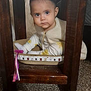 Nita joined the competition — help win amazing prizes! baby, basket, carpet, chair, child, clothing, cozy, cream, curious, expression, face, home, indoors, looking, pattern, portrait, sitting, toddler, wooden_furniture, yellow