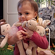 Nita is registered to the contest to win money with this photo: child, toddler, baby, portrait, smiling, happy, indoors, plush_toys, stuffed_animals, bunny, doll, pink_clothing, long_hair, earring, sitting, cuddling, toy_room, cozy, playroom, photography