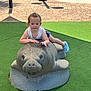 Lexi is registered to the contest to win money with this photo: animal, bear, child, clothing, face, female, girl, grass, head, lawn, nature, outdoorplayarea, outdoors, park, person, photography, plant, playarea, portrait, rock