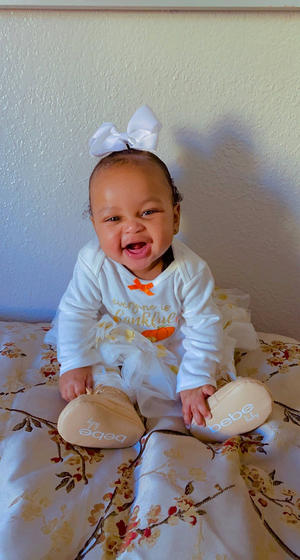 Kaileah is registered to the contest to win money with this photo: baby, baby_toddler_clothing, cheek, child, eye, fashion_accessory, flash_photography, fun, happy, hat, headband, laugh, pattern, person, pink, portrait_photography, sitting, sleeve, smile, t_shirt