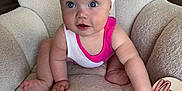 Wrenlee joined the competition — help win amazing prizes! baby, child, infant, bow, headband, pink_clothing, white_clothing, chair, furniture, indoor, cute, expression, face, hand, foot, sitting, soft_texture, curious, portrait, person