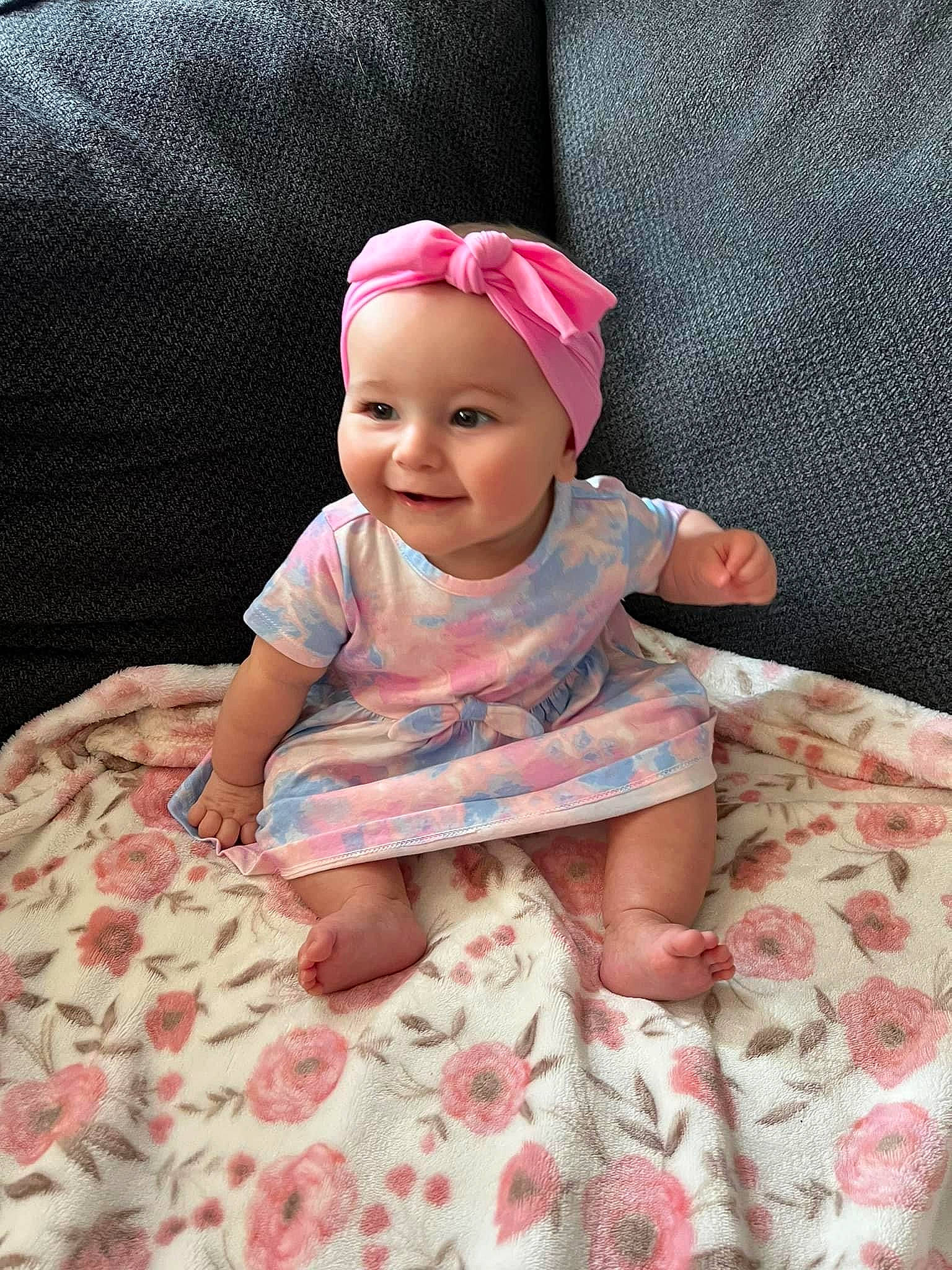 Paisley Grace is registered to the contest to win money with this photo: baby, baby_toddler_clothing, cap, cheek, chin, comfort, eye, fun, hairstyle, happy, headwear, joy, linens, magenta, person, pink, purple, skin, sleeve, smile