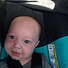 baby, child, car_seat, seatbelt, closeup, infant, face, straps, clothing, smile, young, person, head, indoors, seat, fabric, safety, cute, baby_boy, car