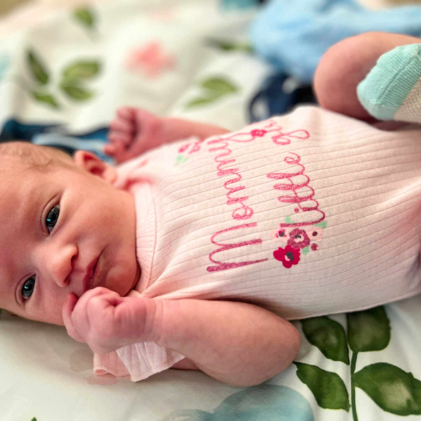 Zoe joined the competition — help win amazing prizes! baby, blanket, bodypart, clothing, face, finger, glove, hand, happy, hat, head, newborn, pattern, person, photography, portrait, quilt, sleeve, smile, t_shirt