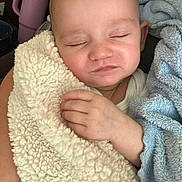 Zoe joined the competition — help win amazing prizes! baby, sleeping, blanket, hand, cozy, soft, closeup, infant, peaceful, face, child, rest, comfort, warm, cuddle, indoors, person, skin, nap, cute