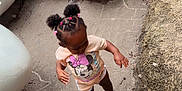 Maleah joined the competition — help win amazing prizes! black_shoes, braids, child, clothing, concrete, curious, dirt, eggshell, footwear, hair_ties, minnie_mouse, nature, outdoor, pink, playground, rocks, sculpture, shorts, standing, toddler