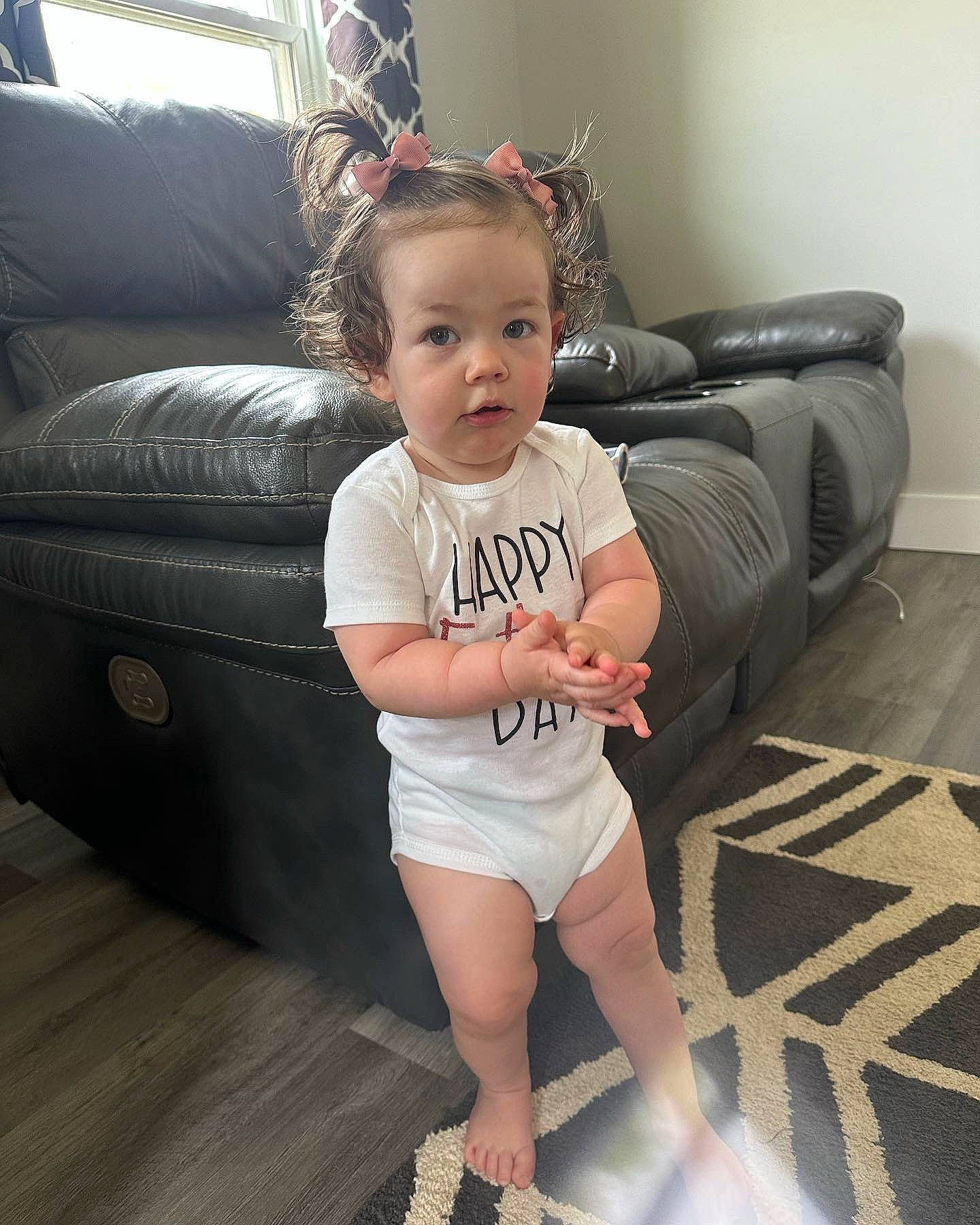 Primrose is registered to the contest to win money with this photo: baby_toddler_clothing, comfort, couch, eye, flash_photography, floor, flooring, happy, head, joint, leg, living_room, neck, person, skin, sleeve, t_shirt, thigh, toddler, waist