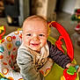 baby, child, smiling, happy, indoor, toy, walker, colorful, clothing, face, person, infant, cute, play, seat, childcare, portrait, young, baby_toy, bright