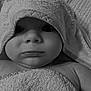 Lisandre a rejoint le concours — aidez-le/la à gagner de superbes lots ! baby, towel, hooded_towel, face, skin, child, portrait, closeup, expression, cute, soft_texture, blanket, infant, wrapped, indoors, newborn, young_child, black_and_white, eyes, mouth
