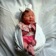 Skylar joined the competition — help win amazing prizes! newborn, baby, infant, blanket, headband, bow, feet, hands, sleeping, wrapped, cute, pink, floral, clothing, soft, bed, portrait, peaceful, closeup, indoors