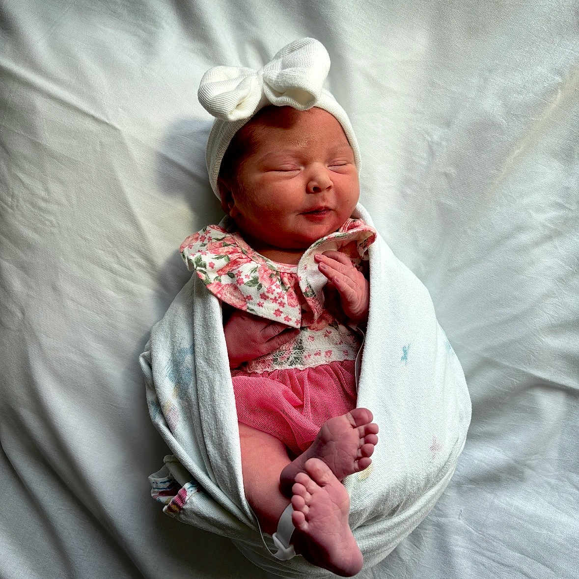 Skylar joined the competition — help win amazing prizes! newborn, baby, infant, blanket, headband, bow, feet, hands, sleeping, wrapped, cute, pink, floral, clothing, soft, bed, portrait, peaceful, closeup, indoors