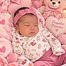 Allis is registered to the contest to win money with this photo: baby, sleeping, infant, portrait, pink, teddy_bear, stuffed_animal, heart, bow, headband, floral_clothing, pajamas, blanket, nursery, cozy, cute, peaceful, closeup, lying_down, princess