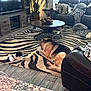 animal, blanket, coffee_table, companion, cozy, cushion, decor, dog, german_shepherd, indoor, living_room, modern_furniture, pet, plant, puppy, relaxing, rug, sofa, wood_floor, zebra_pattern